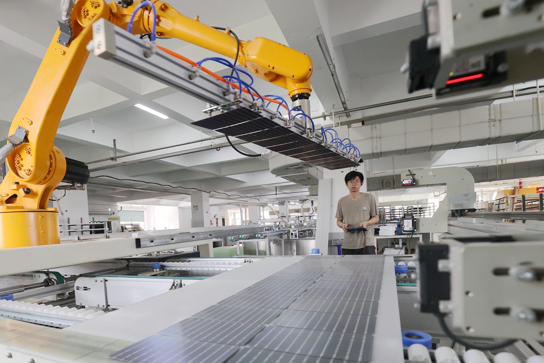 Workers at a photovoltaic panel production workshop in Huzhou, Zhejiang province produce a batch of solar panels for export in June, 2023. Photo: VCG
