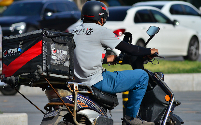 A rider for SF Intra-City in Shenyang, Liaoning province, on July 5, 2023